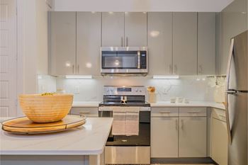 Designer kitchen cabinets with stainless steel appliances